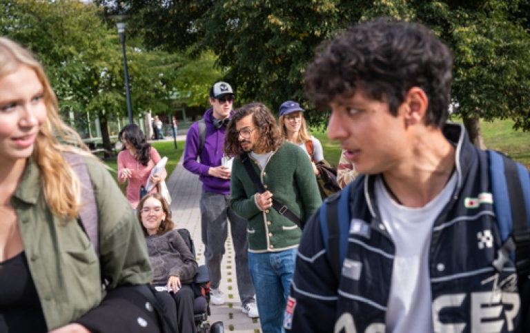 Student group outdoors in the meadow.