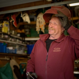 Elderly man in a tools shed. Photo: David Tett