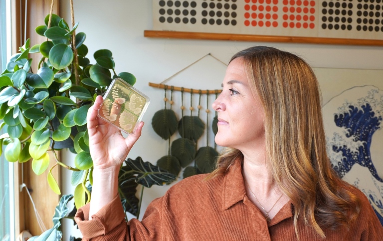 Researcher Rike Stelkens holds up the wild yeast